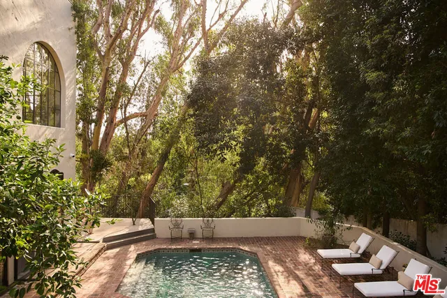 view of outdoor space with deck and trees