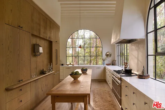 a very nice looking kitchen with a large window