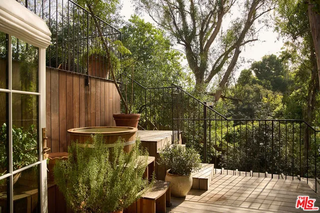 a view of balcony with furniture
