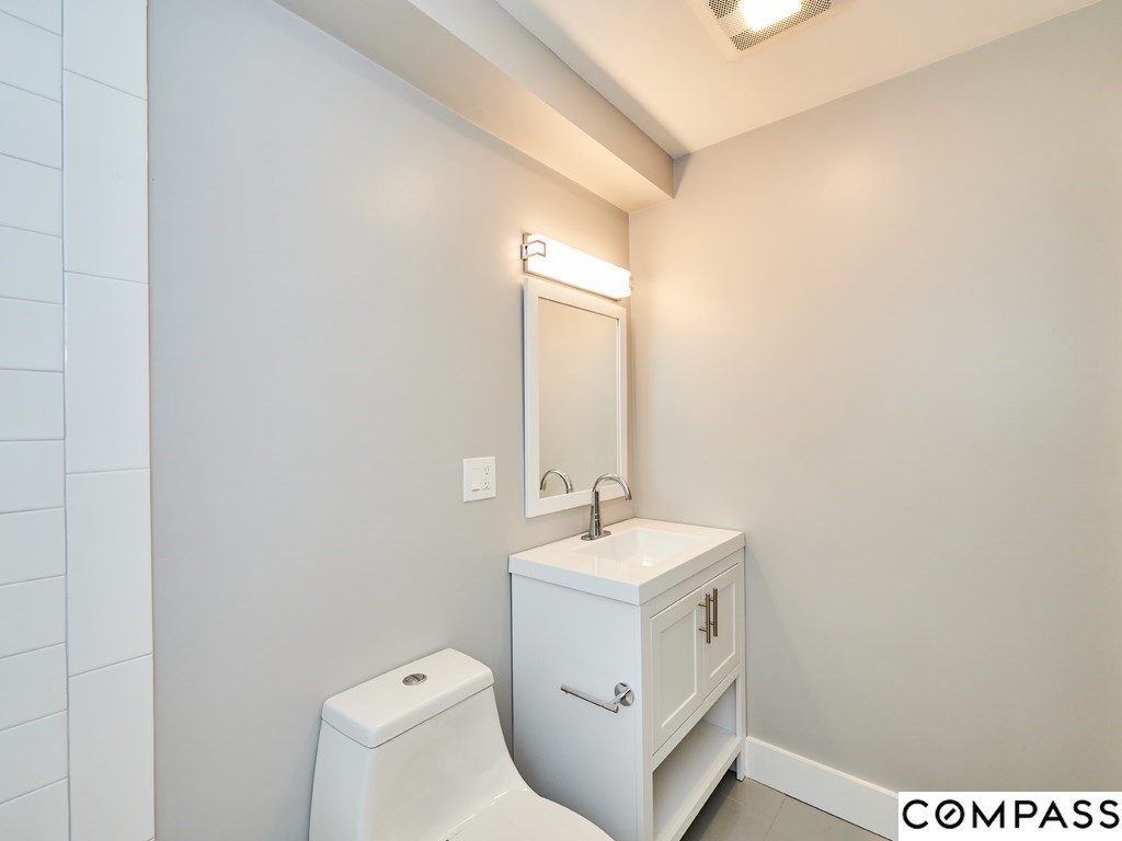 145 Pearl Street, Unit 145 Cambridge, MA 02139 - Photo 12 of 26 a bathroom with a sink and a mirror