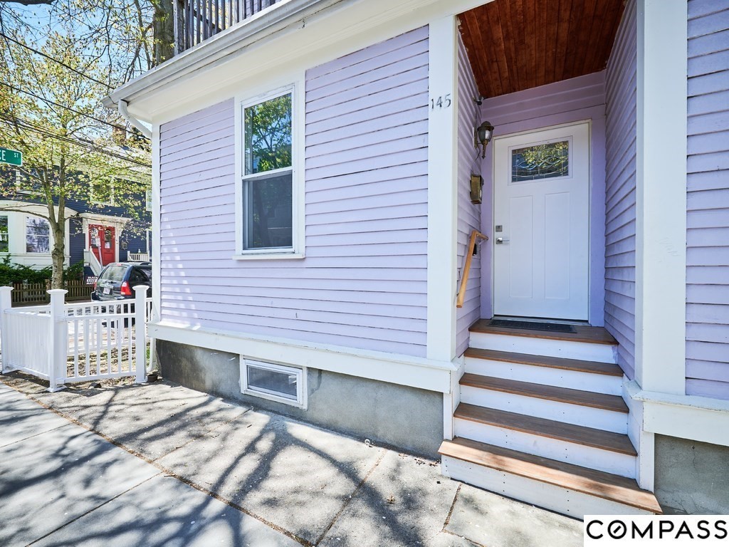 145 Pearl Street, Unit 145 Cambridge, MA 02139 - Photo 2 of 26 a view of a house with a yard and sitting area