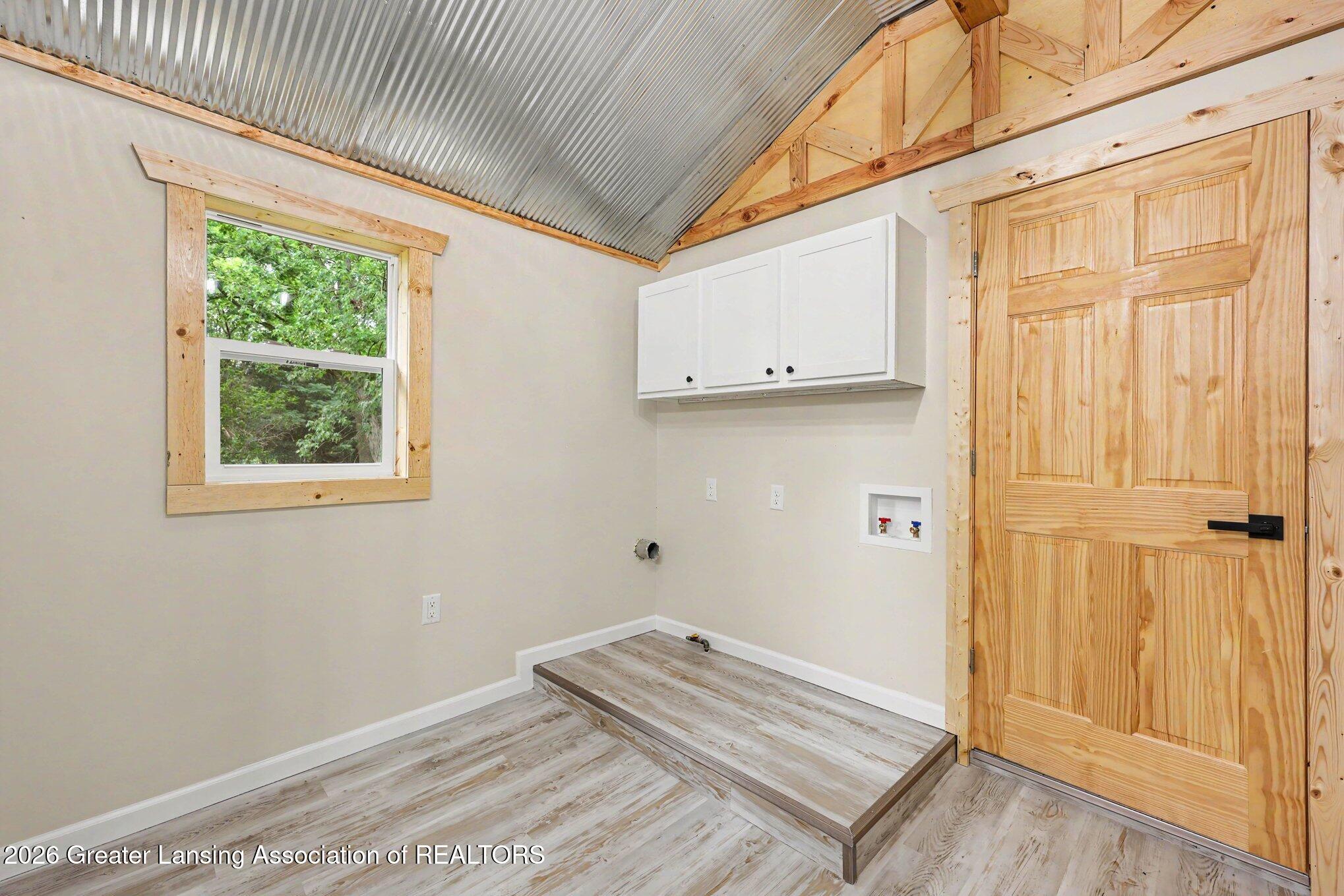 871 Dart Road Mason, MI 48854 - Photo 20 of 26 Laundry Hook up in Bathroom