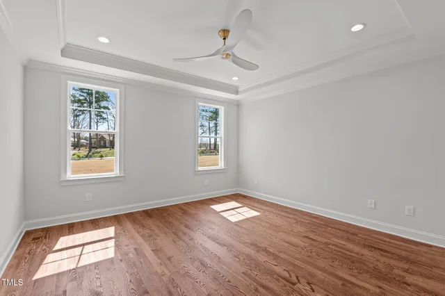 a view of kitchen with granite countertop stainless steel appliances and a fireplace