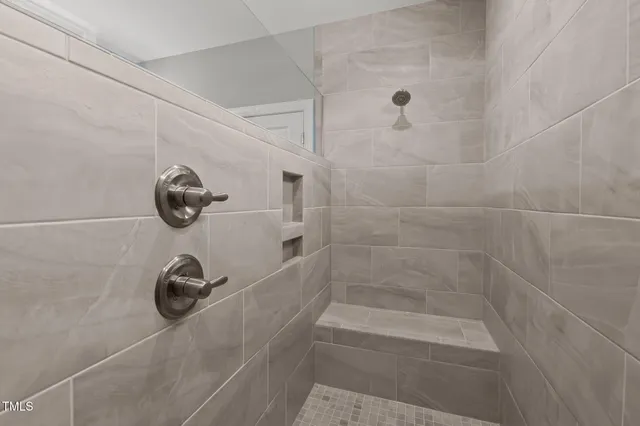 a bathroom with a sink double vanity and a mirror