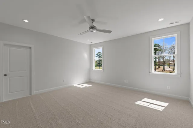 a bathroom with a double vanity sink toilet and a mirror