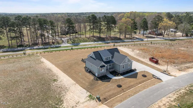 a view of a swimming pool with lawn chairs