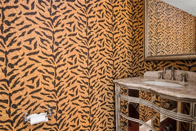 a utility room with a sink and a bench