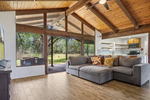 a living room with furniture and a large window
