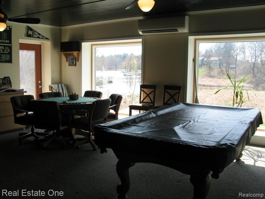 820 Brighton Lake Road Brighton, MI 48116 - Photo 39 of 42 Bonus/Rec room looking out onto Lake