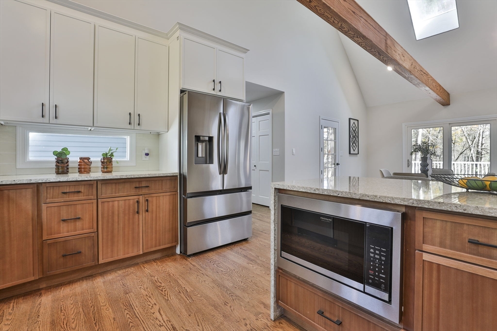 72 Ayer Road Harvard, MA 01451 - Photo 12 of 38 a kitchen with stainless steel appliances granite countertop a refrigerator a stove a sink and dishwasher with wooden floor