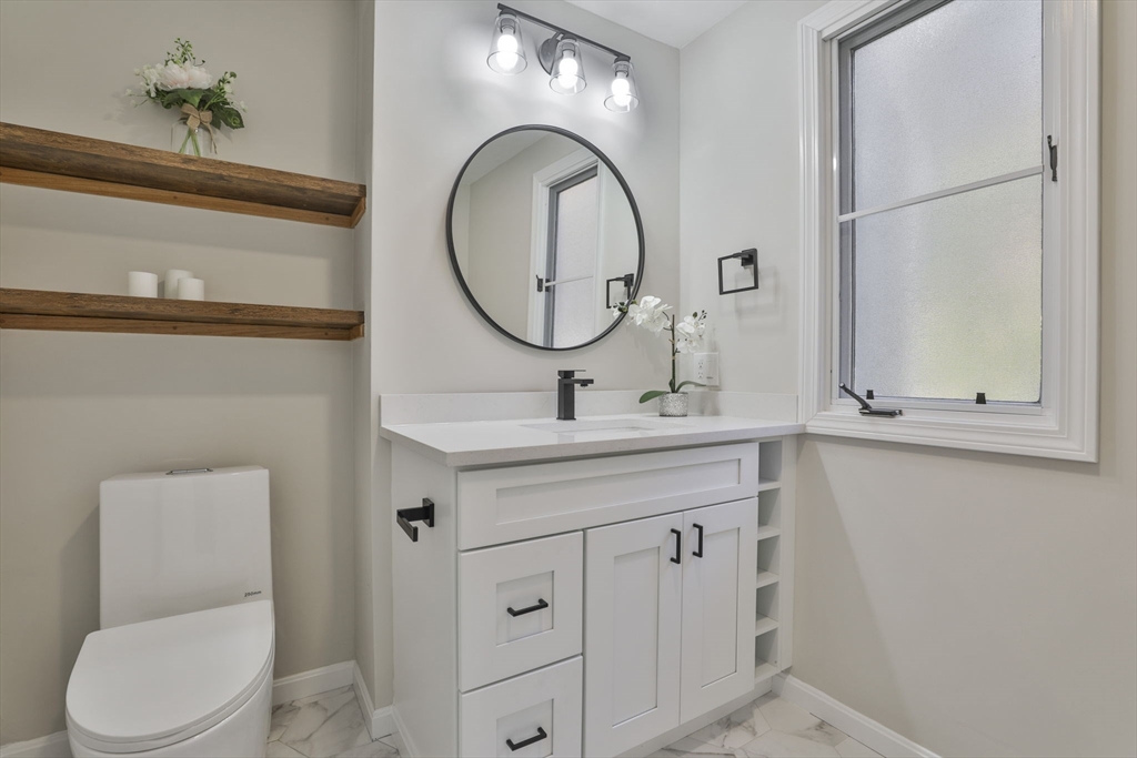 72 Ayer Road Harvard, MA 01451 - Photo 20 of 38 a bathroom with a toilet a sink and mirror
