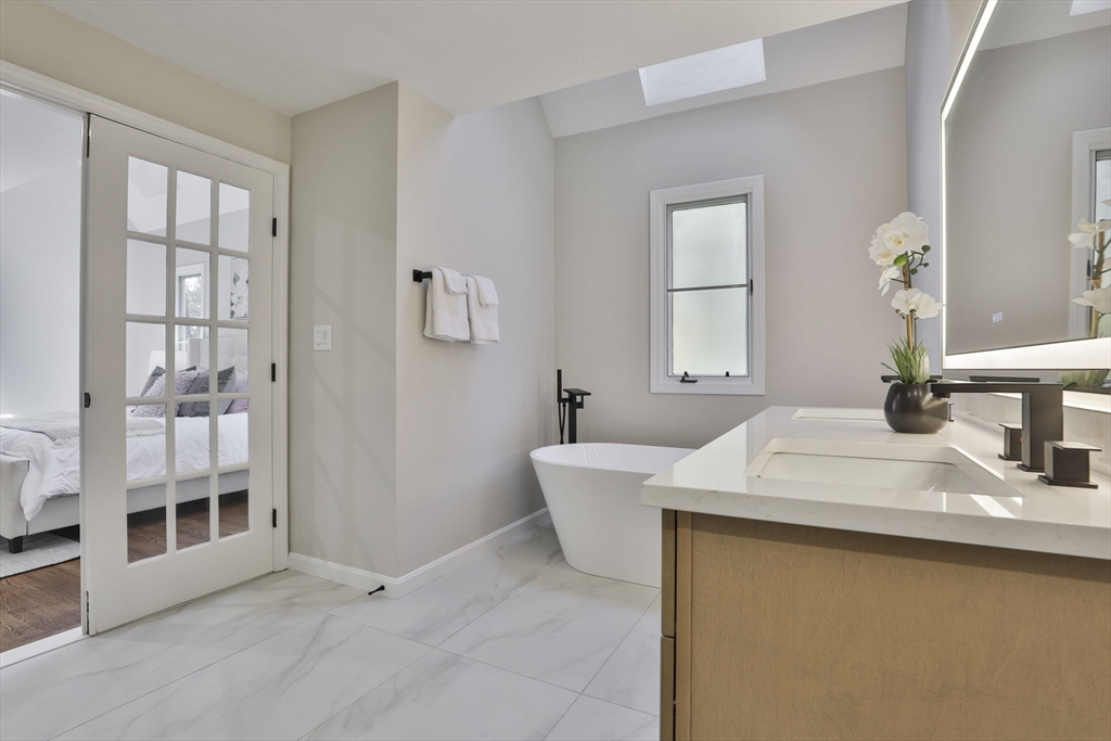 72 Ayer Road Harvard, MA 01451 - Photo 23 of 38 a bathroom with a sink and a mirror