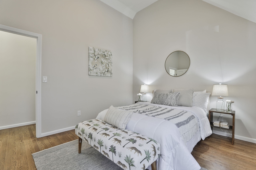 72 Ayer Road Harvard, MA 01451 - Photo 29 of 38 a bedroom with a bed and wooden floor