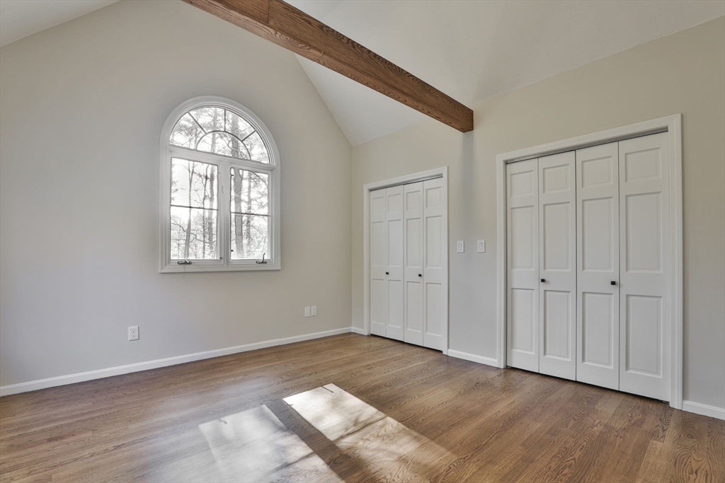 72 Ayer Road Harvard, MA 01451 - Photo 30 of 38 a view of an empty room with wooden floor and a window