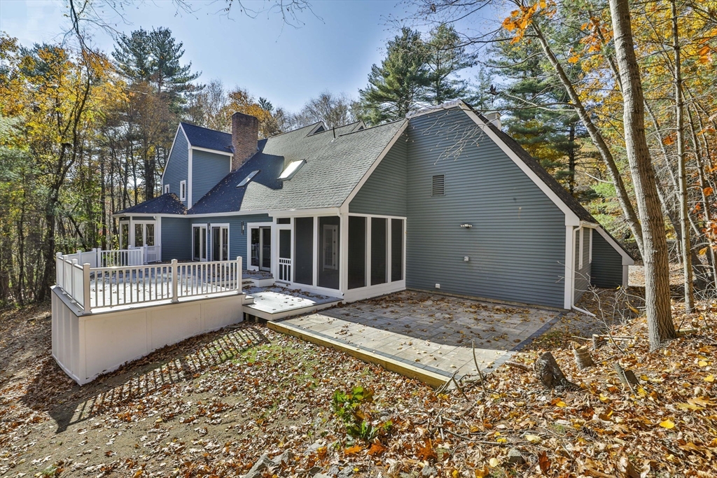 72 Ayer Road Harvard, MA 01451 - Photo 37 of 38 a view of backyard with a patio and wooden fence