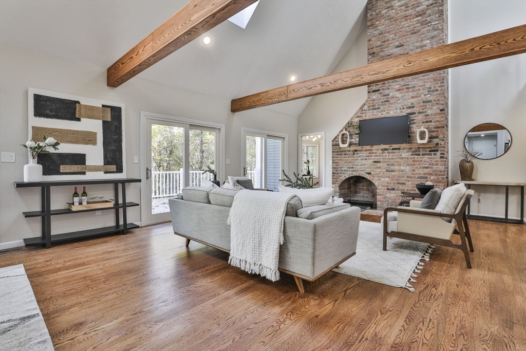72 Ayer Road Harvard, MA 01451 - Photo 4 of 38 a living room with furniture a fireplace and a flat screen tv