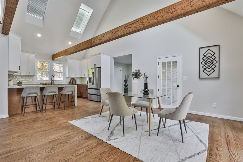 72 Ayer Road Harvard, MA 01451 - Photo 7 of 38 a view of a dining room with furniture and wooden floor