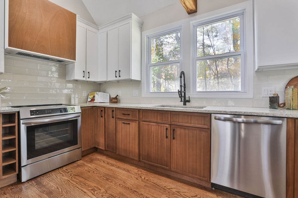 72 Ayer Road Harvard, MA 01451 - Photo 10 of 38 a kitchen with granite countertop a stove sink and cabinets