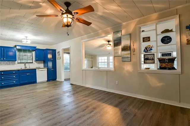 a view of a hallway with a door and stairs