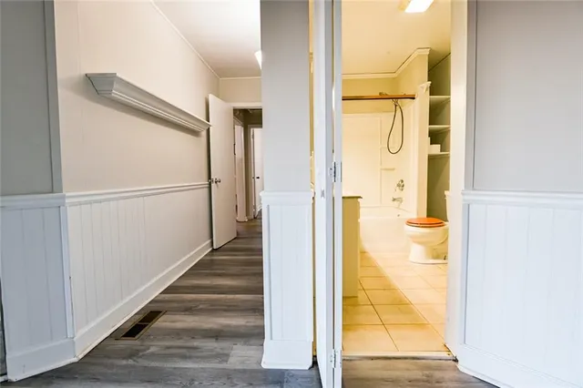 a view of balcony with wooden floor and fence and trees