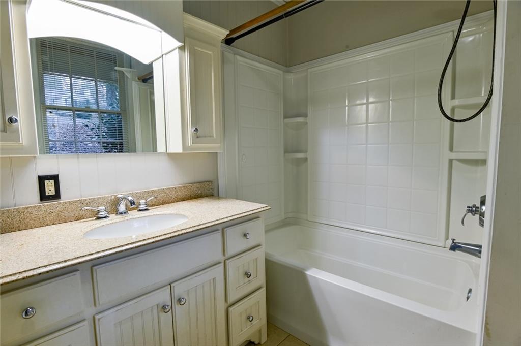 458 Haley Road Jackson, GA 30233 - Photo 29 of 58 a bathroom with a granite countertop sink a toilet and shower