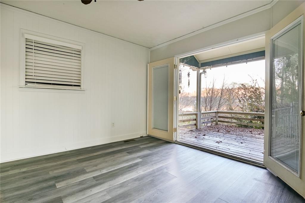 458 Haley Road Jackson, GA 30233 - Photo 30 of 58 an empty room with wooden floor and windows