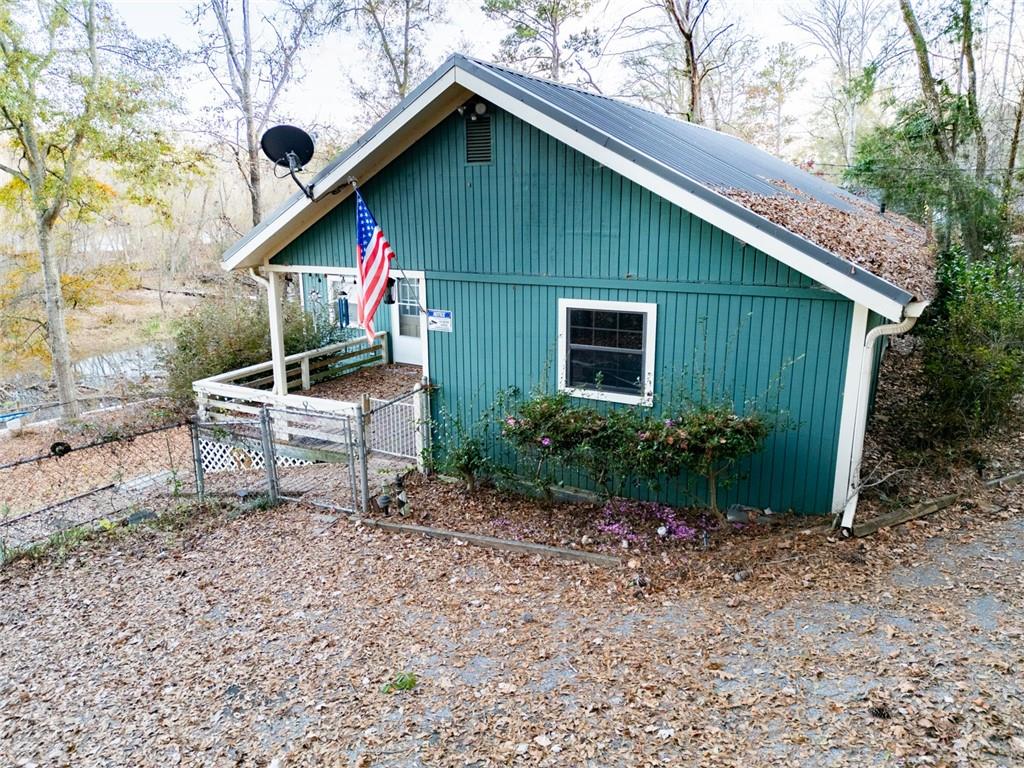 458 Haley Road Jackson, GA 30233 - Photo 3 of 58 a backyard of a house with wooden fence and trees