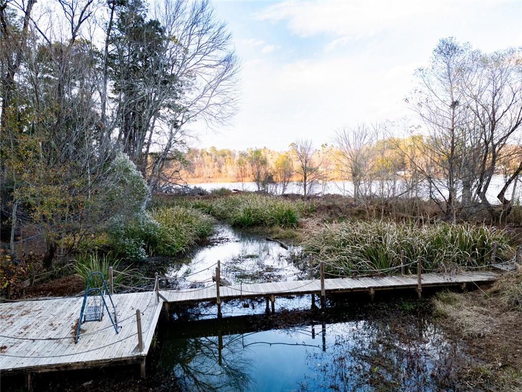 458 Haley Road Jackson, GA 30233 - Photo 33 of 58 a view of a lake from a balcony with furniture