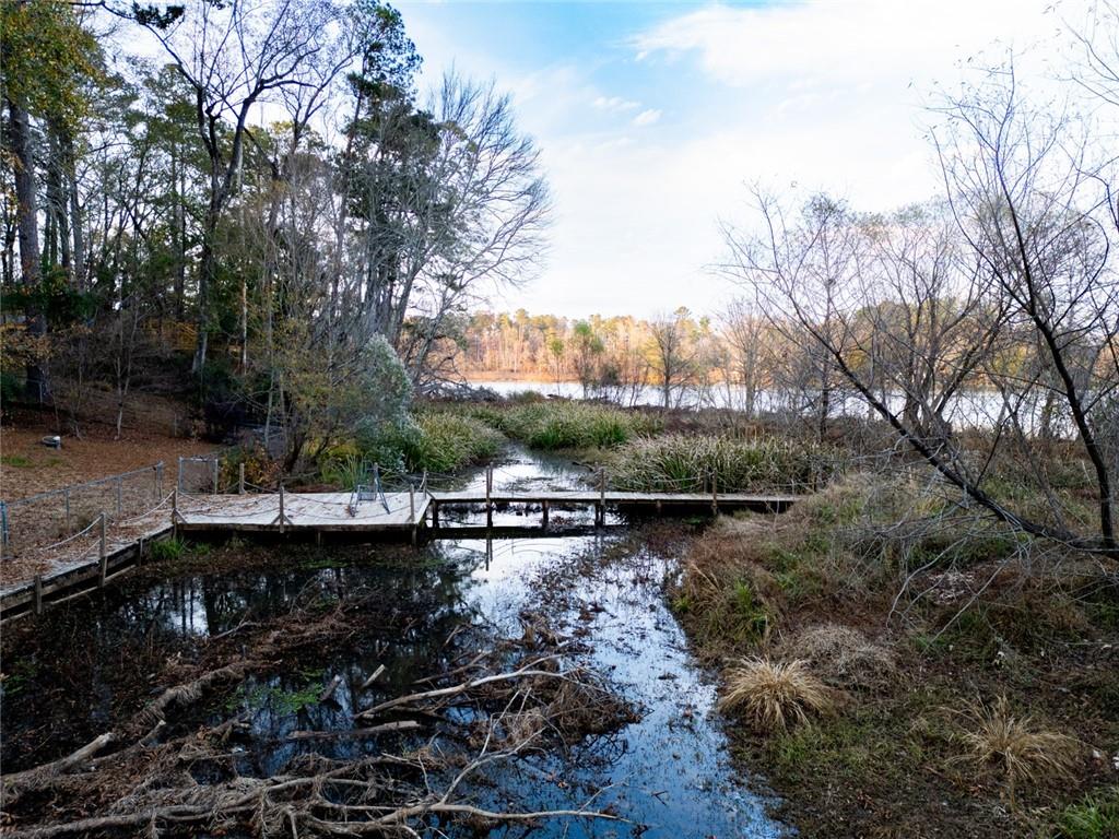 458 Haley Road Jackson, GA 30233 - Photo 34 of 58 a view of a lake with a house in the background