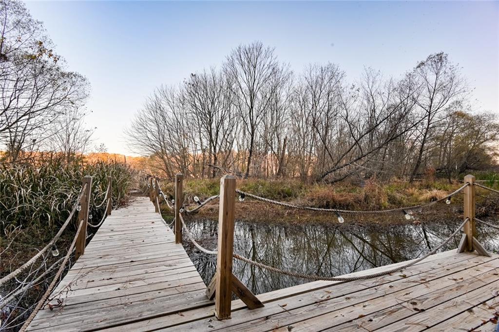 458 Haley Road Jackson, GA 30233 - Photo 35 of 58 a view of balcony with wooden floor and fence and trees