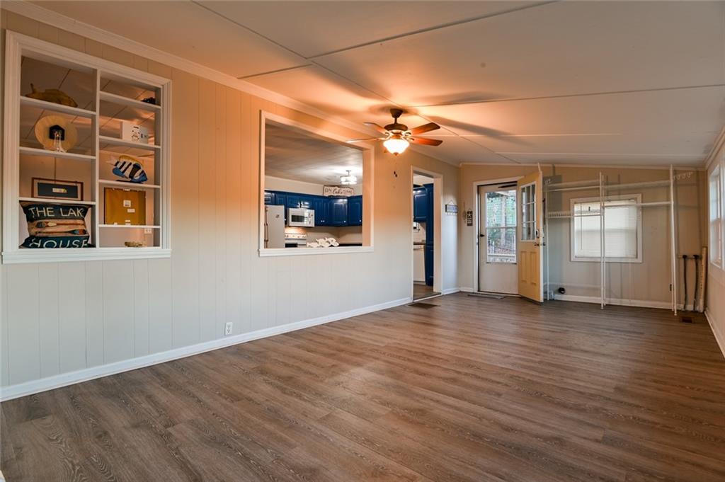 458 Haley Road Jackson, GA 30233 - Photo 9 of 58 a view of a big room with wooden floor and windows