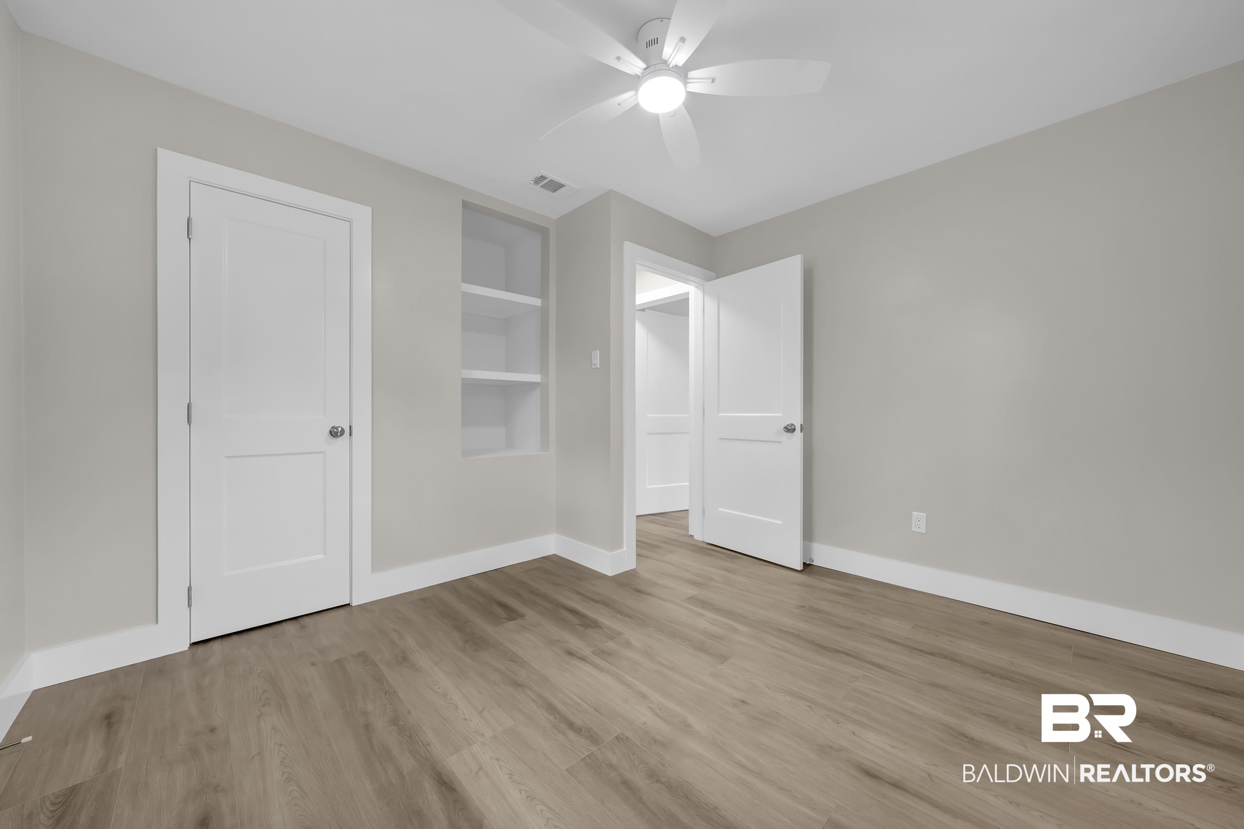11381 Normandy Drive East Semmes, AL 36575 - Photo 13 of 23 Unfurnished bedroom featuring light wood-type flooring and ceiling fan
