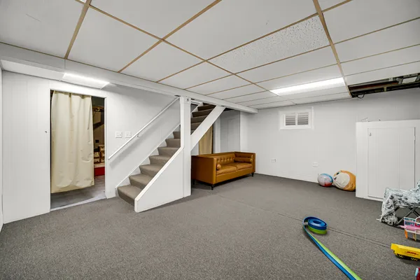 a view of an empty room with stairs