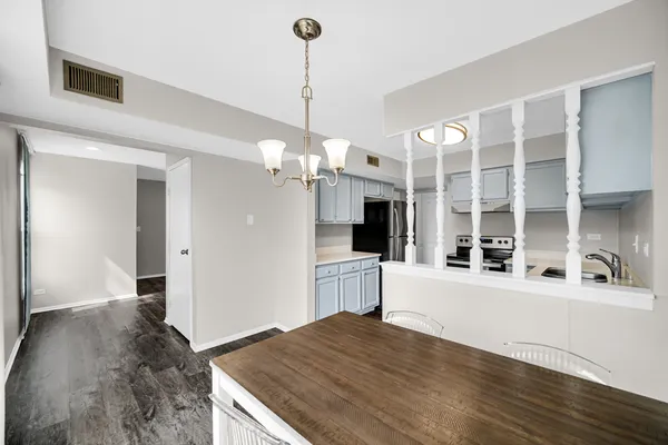 a kitchen with a sink and a stove top oven