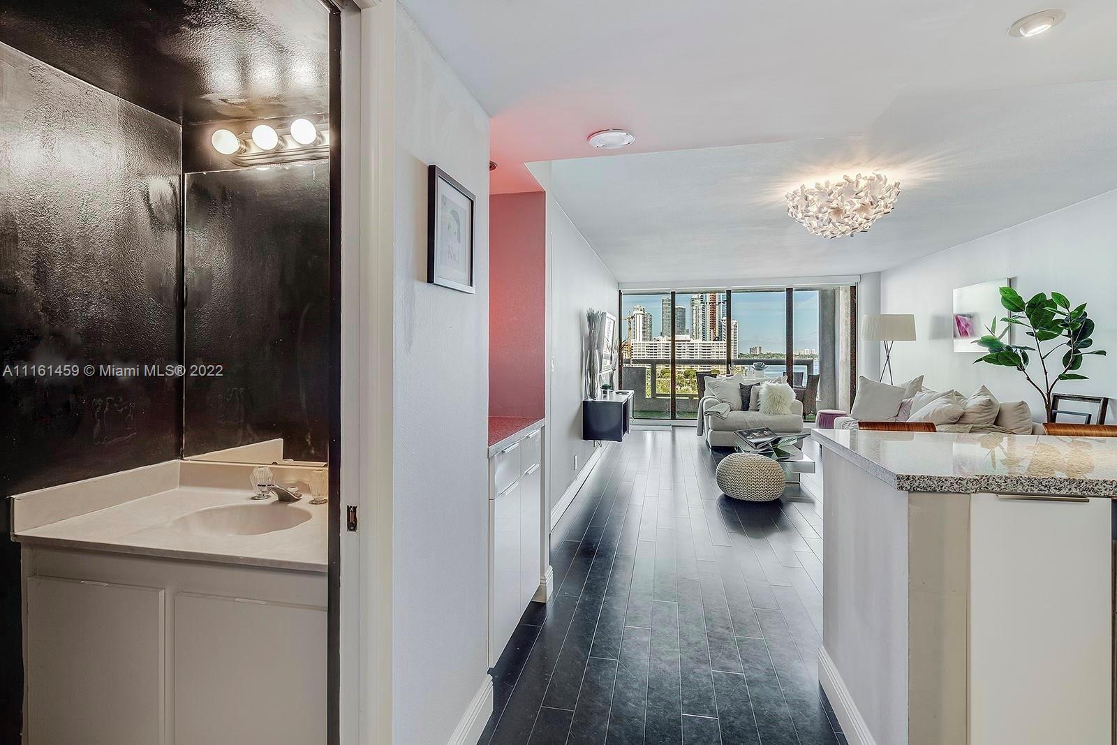 1717 North Bayshore Drive, Unit A1239 Miami, FL 33132 - Photo 12 of 16 a en suite bathroom with double vanity and a tub