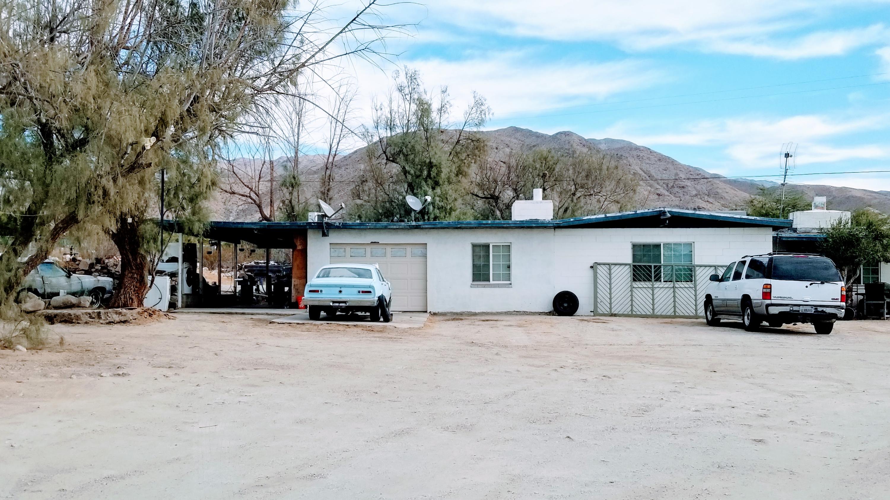 82750 Dillon Road Desert Hot Springs, CA 92241 - Photo 1 of 4 a car parked in front of a building