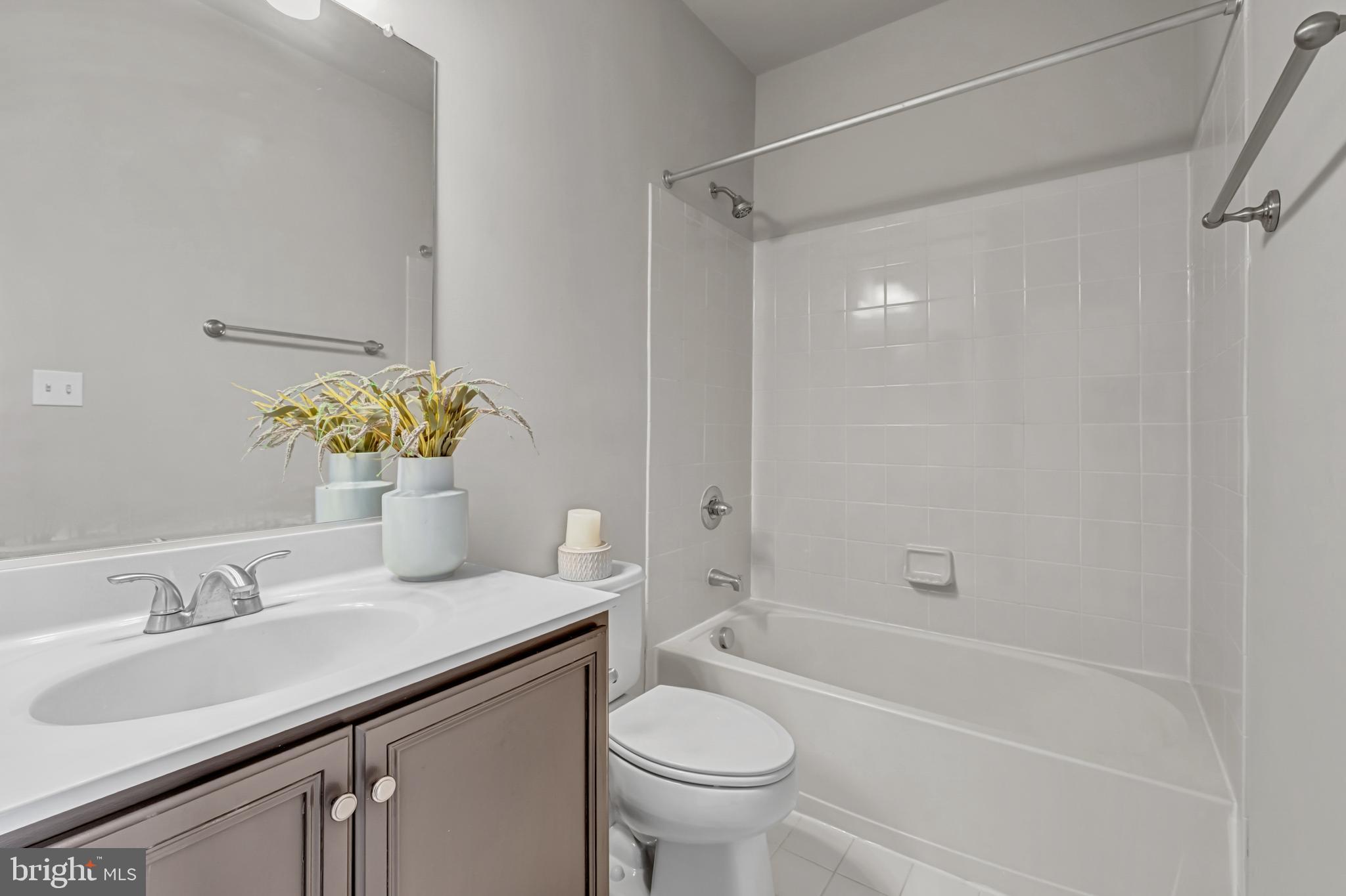 42790 Nations Street Chantilly, VA 20152 - Photo 32 of 40 a bathroom with a sink toilet and shower