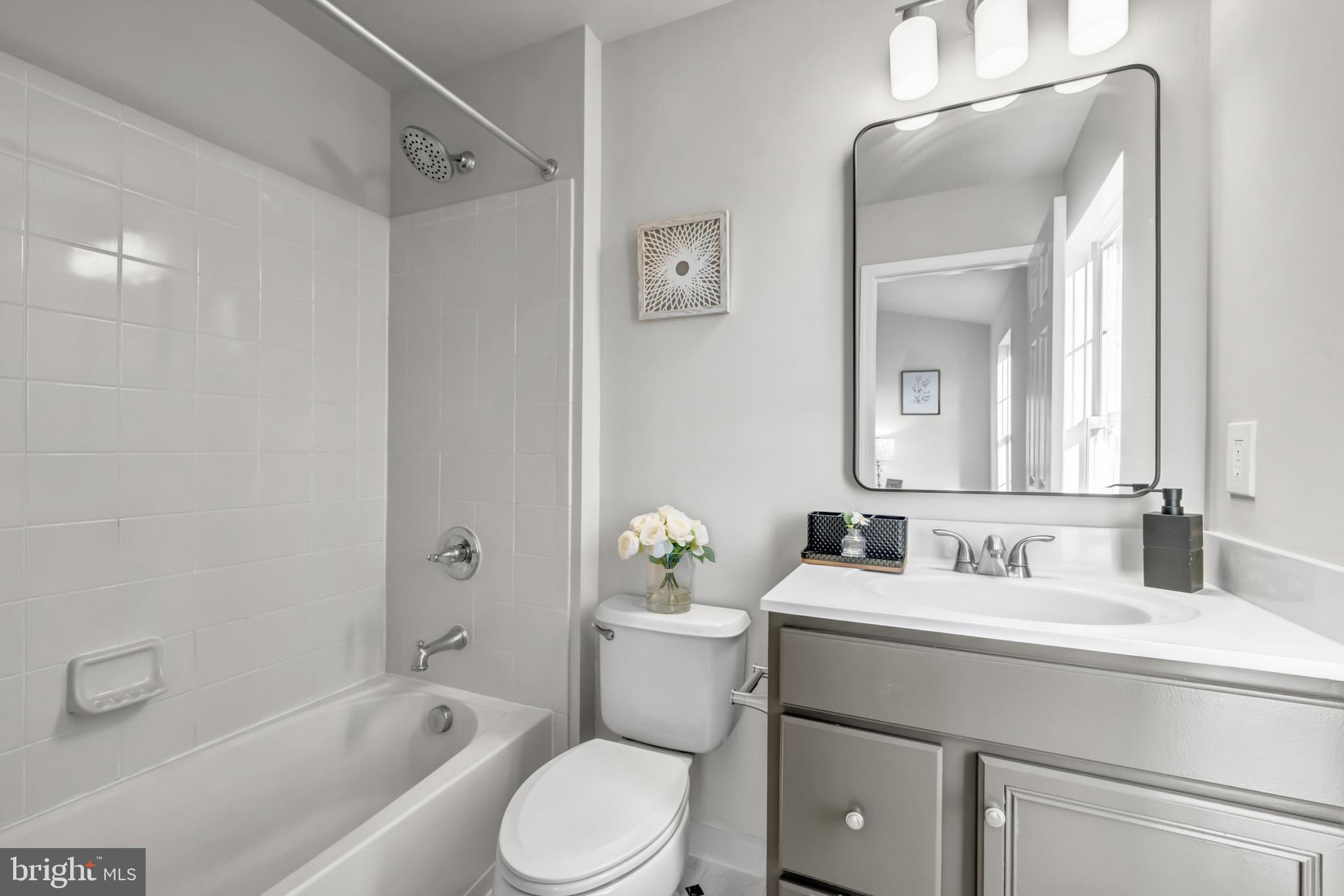 42790 Nations Street Chantilly, VA 20152 - Photo 34 of 40 a bathroom with a sink toilet and shower