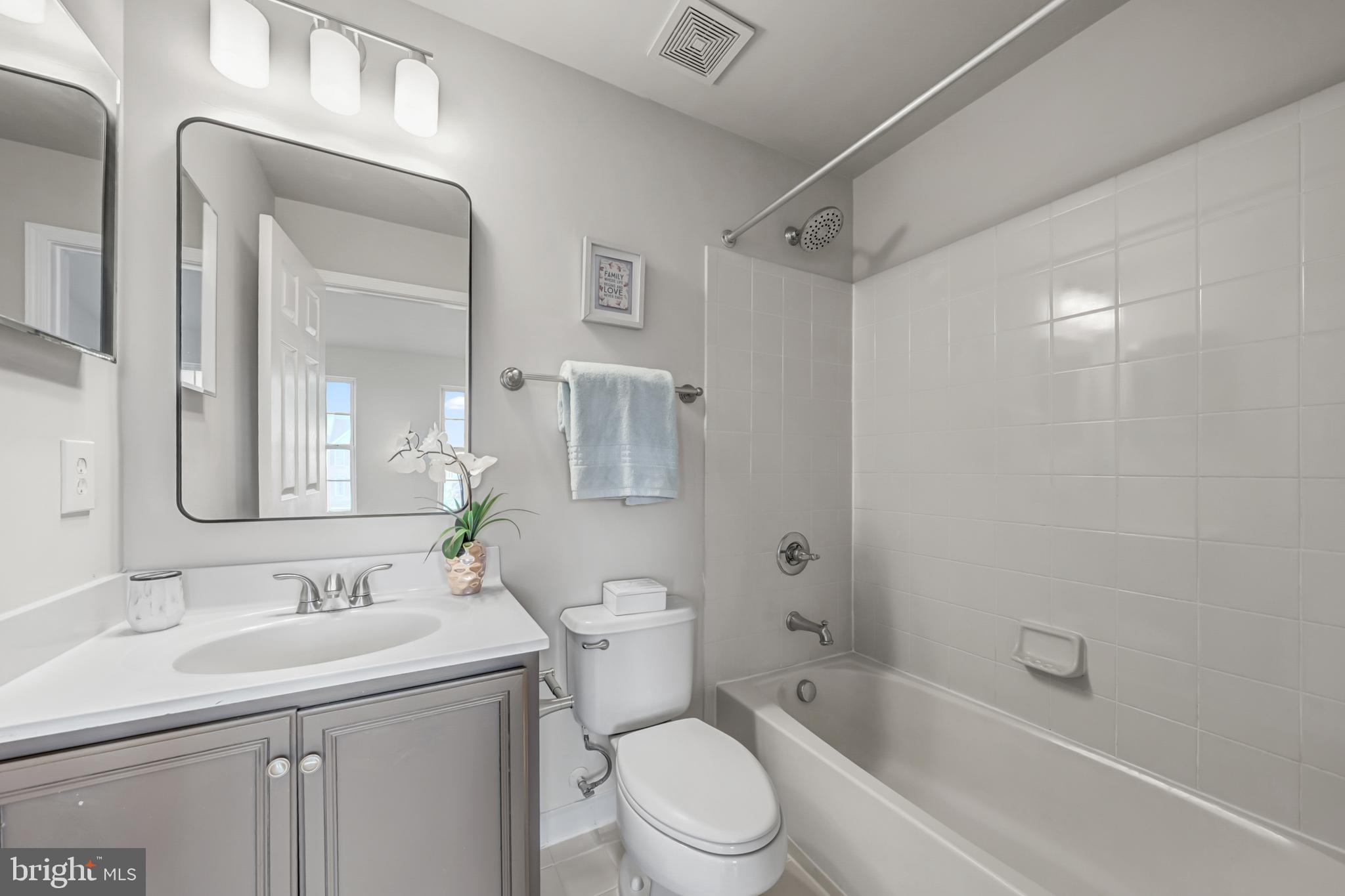 42790 Nations Street Chantilly, VA 20152 - Photo 35 of 40 a bathroom with a sink toilet vanity and shower