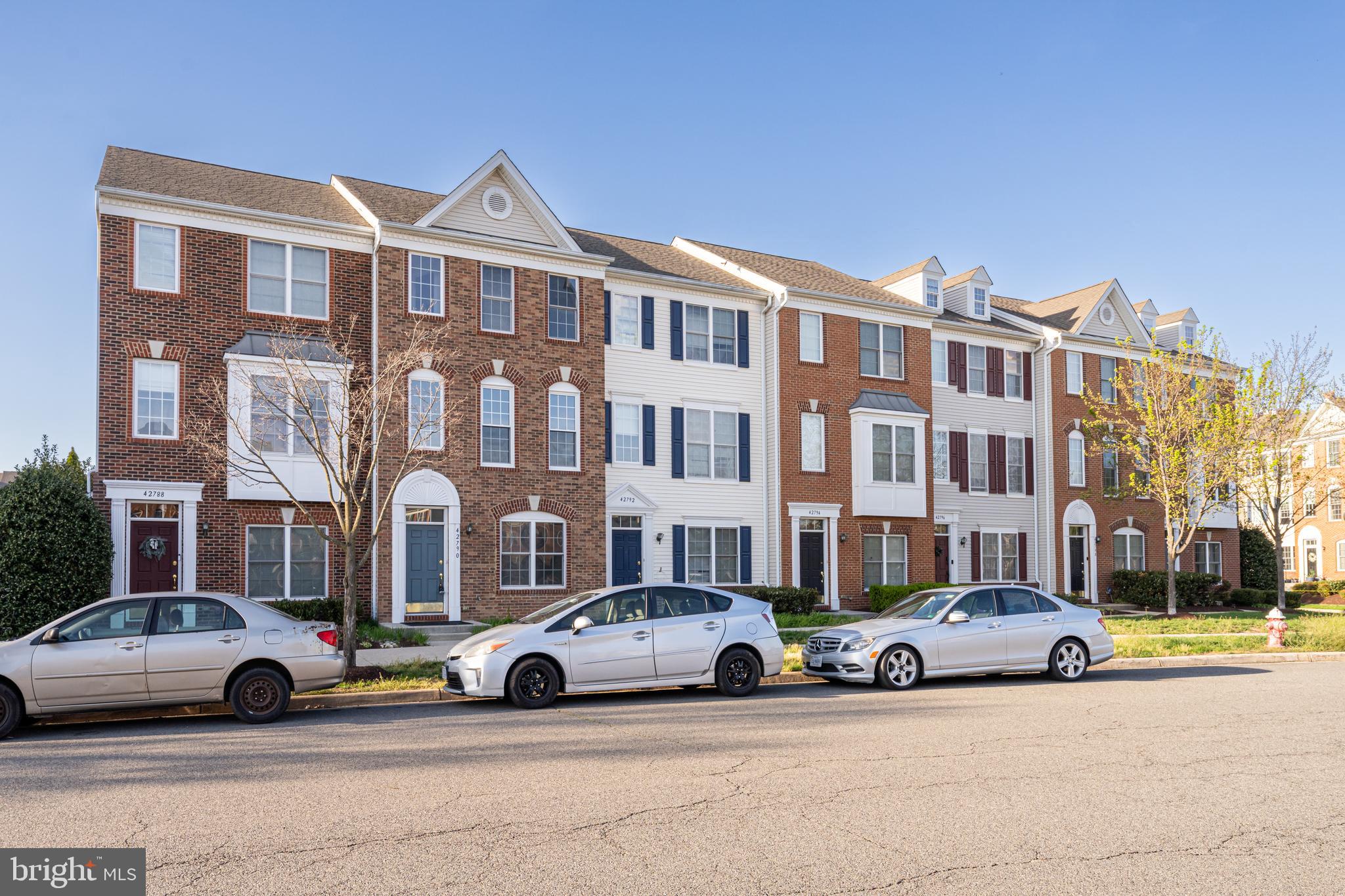 42790 Nations Street Chantilly, VA 20152 - Photo 5 of 40 a view of a building with lot of cars and trees
