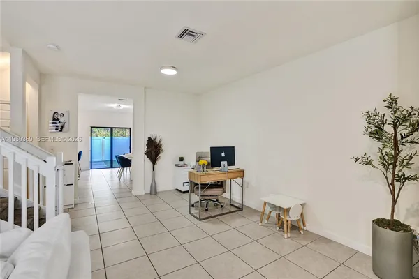 a living room with furniture and a table