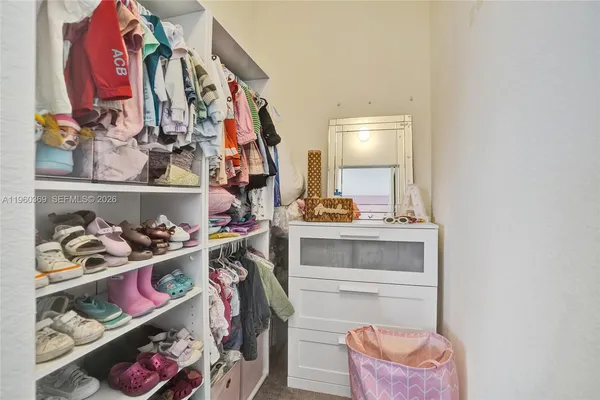 a bathroom with a sink vanity and a mirror