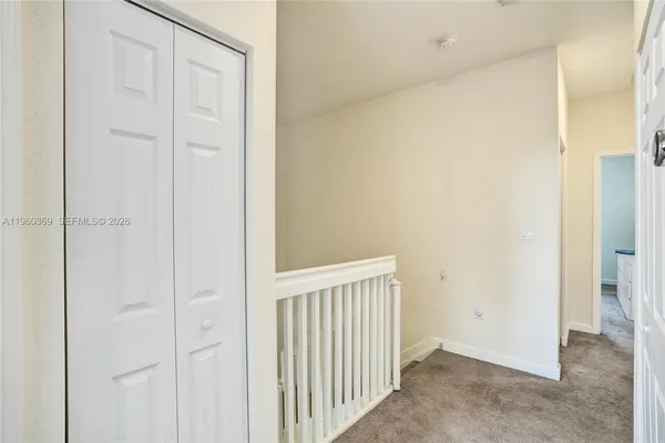 a bedroom with a bed and closet