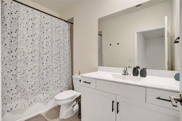 a bedroom with a bed and a cabinets