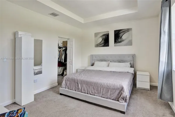 a view of walk in closet with clothes