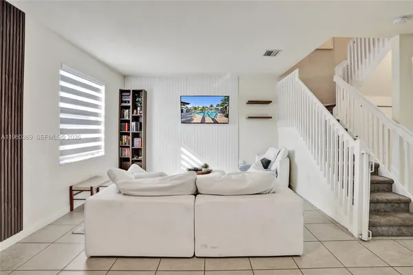 a living room with furniture and a window