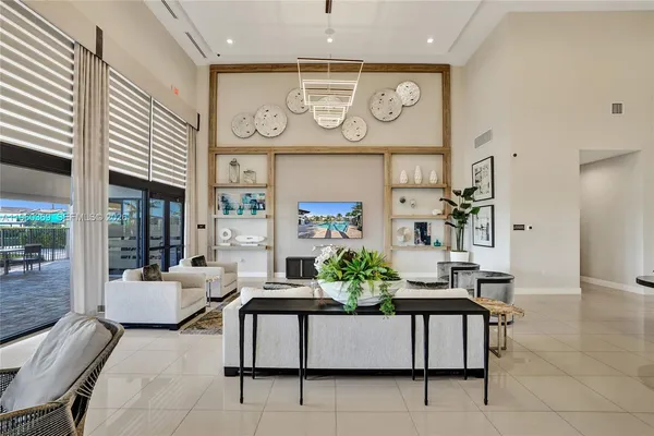 a view of swimming pool with outdoor seating and plants