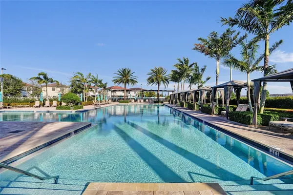 a view of a patio with a table chairs and a fire pit
