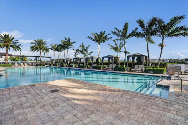 a view of a park with slide and a bench