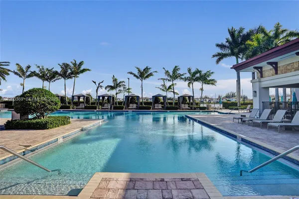 a view of a lake with houses in the back
